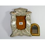 Embossed silver photograph frame (AF) 24cms tall together with a small Indian brass framed mirror