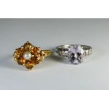 Two 9ct gold ladies stone set dress rings, one citrine the other amethyst.