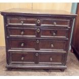 A Jacobean oak chest of four long draws with knob handles,