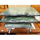 A nest of three chrome framed coffee tables with green inset marble tops