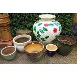 Six assorted ceramic and other garden pots and one very large garden pot