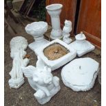 A quantity of white painted reconstituted stone garden ornaments including an owl, a flying pig,