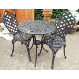 A black painted garden bistro table with two matching chairs