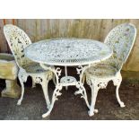 A white painted aluminium Victorian style circular garden table with two matching chairs