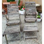 A set of six hardwood well weathered garden chairs and two matching reclining sun loungers with