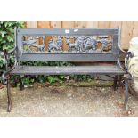 A small metal ended garden bench for a child and iron framed garden seat with slats both as found