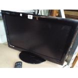 A 22" digital LCD TV with Freeview etc and integrated DVD box with remote