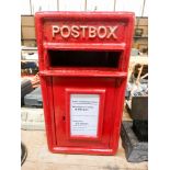 A red reproduction cast post box