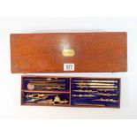 A part technical drawing set contained within its mahogany box with brass name plate and key