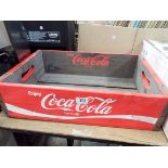 A wooden Coco Cola advertising crate