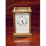 An Edwardian gilt brass carriage clock with presentation inscription dated 1914,