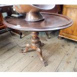 An oval mahogany tray top table on a Victorian walnut pillar and tripod base