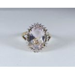 9ct gold ladies dress ring set with a large oval kunzite or pale amethyst,