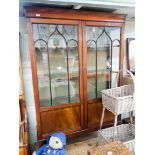 A 1920's mahogany china display cabinet with two Gothic glazed doors