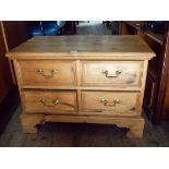 An antique wax pine TV stand with drawers