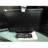 A 15" Alba digital LCD TV with freeview etc and a remote