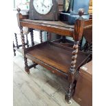 An oak barley twist two tier tea trolley