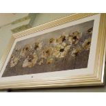 A large silver framed print of poppies