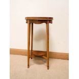 An oval satinwood shell inlaid two tier lamp table with pullout slide, 13" x 10.