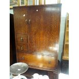 A pair of nearly new oak stool with dark brown faux leather tops