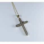 9ct yellow gold cross pendant set with channel set CZ stones, on fine gold chain, weight 3.8 grams.