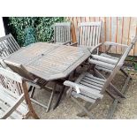 Folding teak oval garden table and six fold-up chairs