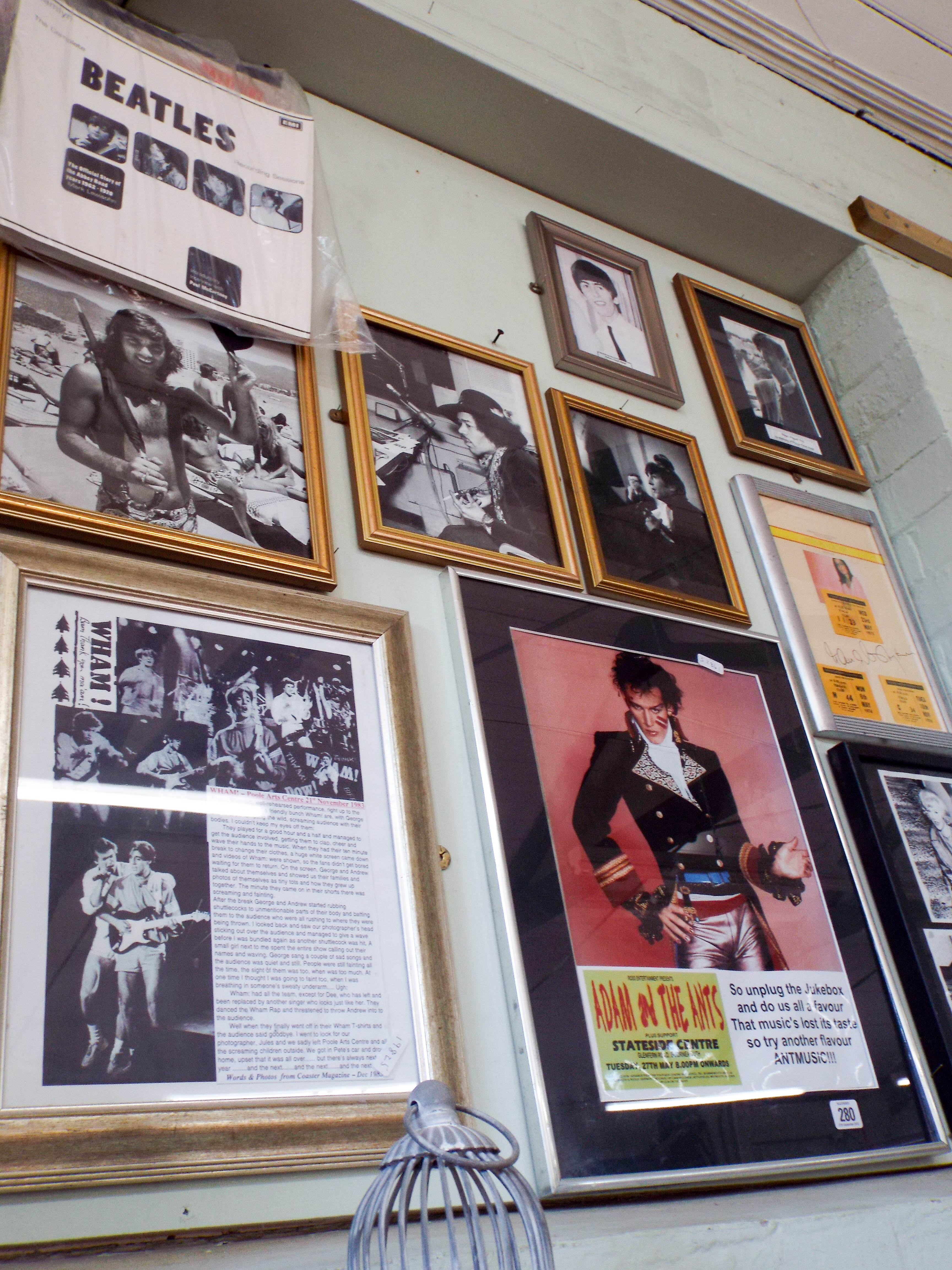 A collection of pop memorabilia, framed poster of Adam and the Ants,