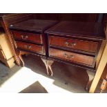 A pair of Georgian style mahogany bedside cabinets each fitted two drawers