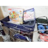 A Silver Cross pram, a Fisher-Price baby bouncer,