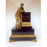 A 19th century black marble and gilt bronze mounted architectural style table clock decorated with