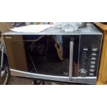 A Kenwood microwave oven in a stainless steel finished case