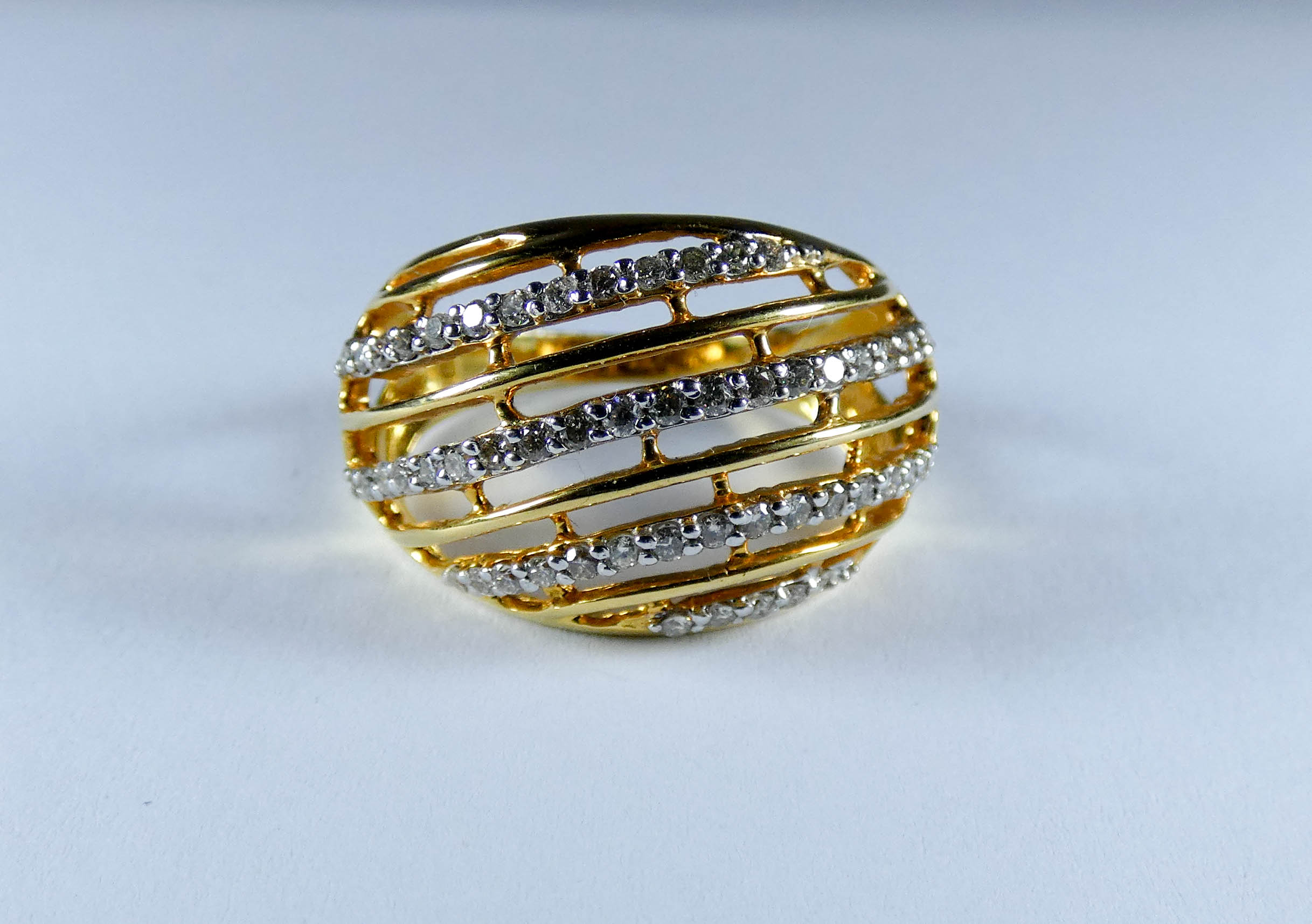 18ct yellow gold bombe dress ring set with four rows of brilliant cut diamonds, ring size Q,