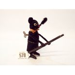 A Schuco, wind-up mechanical toy, of a black bear chimney sweep with ladder,