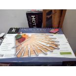 A set of stainless steel knife set, a hot plate,