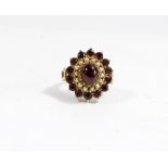 A 9ct gold garnet and seed pearl oval cluster cocktail ring,