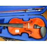 A child's violin in ridged carry case