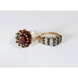 A 9ct gold garnet oval cluster dress ring together with a sapphire and diamond dress ring set in