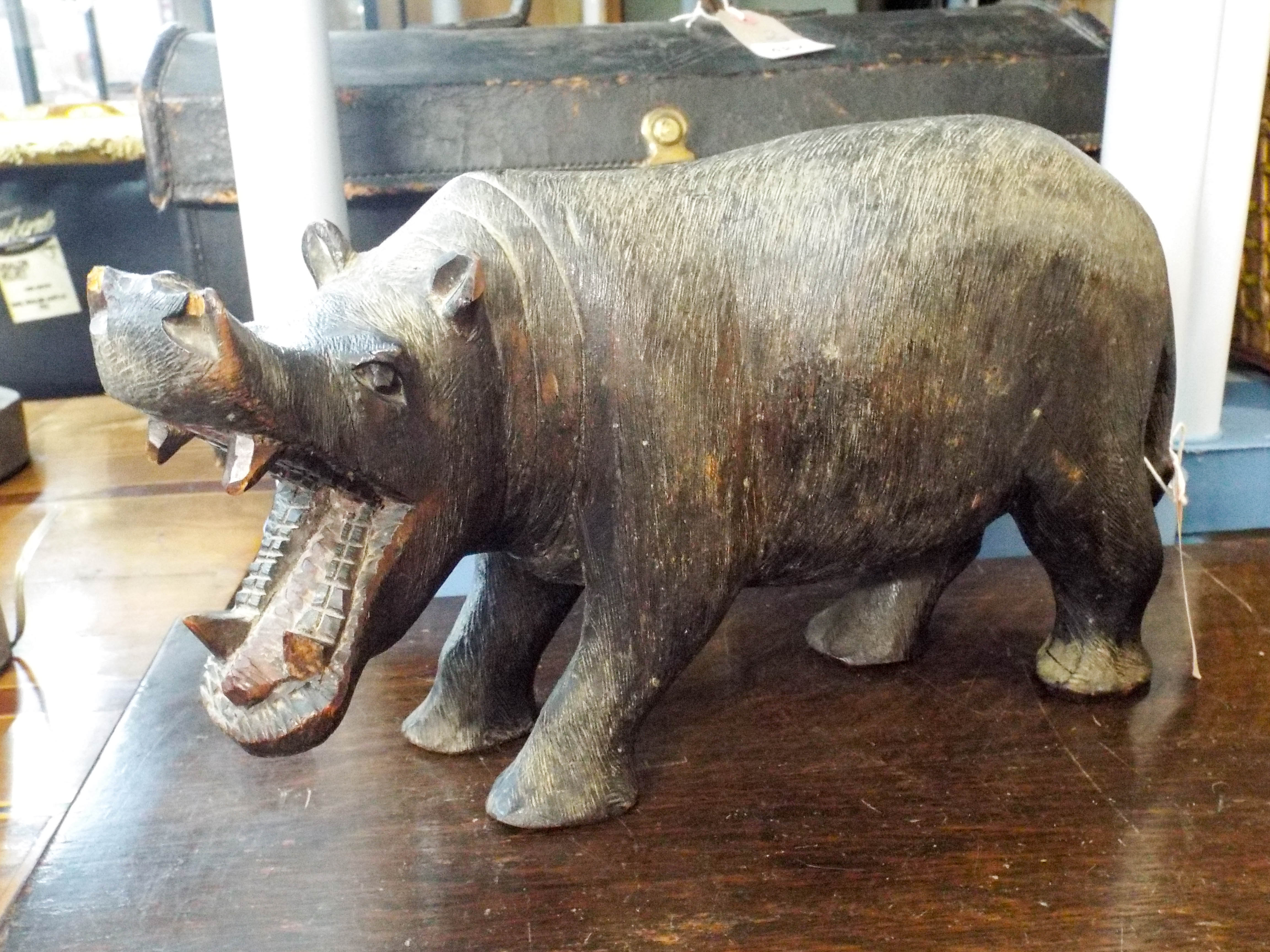 A carved treen model of a hippo