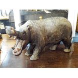 A carved treen model of a hippo