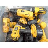 A box of Dewalt cordless drills,