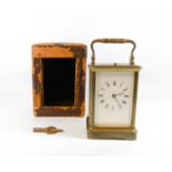 A gilt brass carriage clock with repeater mechanism, the white enamel dial signed E W Streeter,
