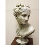 A reconstituted classical stone bust of a lady