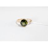 Green tourmaline claw set ladies dress ring, on unmarked gold shank. Ring size R weight 3.
