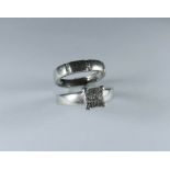 Platinum wedding band with diamond detail and a diamond set engagement ring,