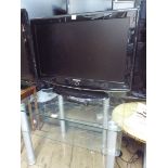 A Samsung 32" digital LCD television with freeview etc and remote together with a three tier chrome