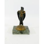 A 19th century bronze bird desk stand, perhaps for pens, resting on a green marble base,