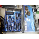 A new 40 piece screw driver set and a new 25 piece drum sanding kit