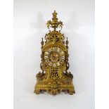 French gilt metal mantel clock with blue enamelled numerals applied to the dial,