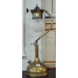 An early 20th century brass adjustable oil lamp