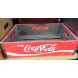 A wooden Coco Cola advertising crate